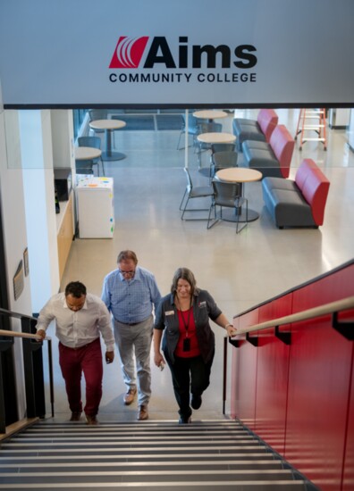 Mary Gabriel, Executive Campus Director of Aims Community College gives Dennis and Arnold a tour.