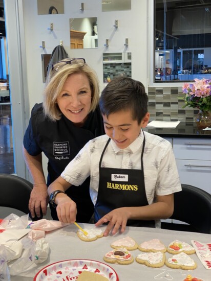 Chef Jackie Dodart alongside cooking school student, Ruben