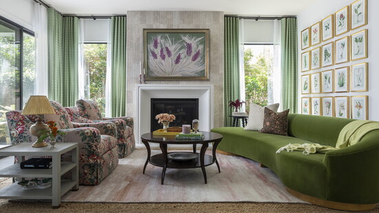 Fluted stone tile was installed on the fireplace wall of this room designed by Emily Spanos.