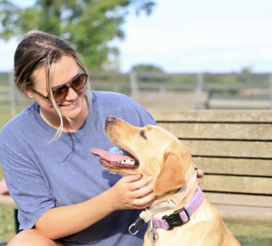 Camille Bauer and Kenny, her 2-year-old yellow lab on a recent visit to the Bellevue dog park.