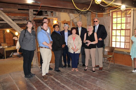 Andy Calamras and members of The Frazee House board inside the historical spot.