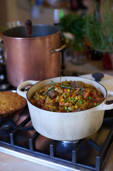 A Le Creuset pot or other heavy cast iron version is worth the investment, as it lasts a lifetime and holds the heat.