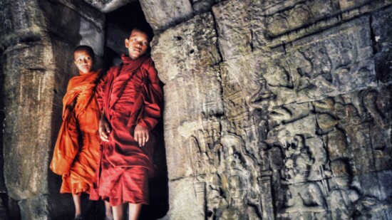 These young monks in Ankor Thom Cambodia were very willing and playful models. I love the colored robes against the stone.