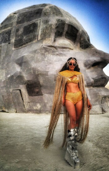 Burning Man is all about style and creativity. I choose this image because of self expression in costume and art.