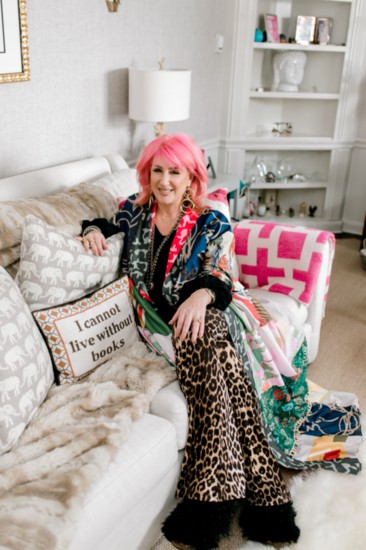 Sitting on the sofa in her office.