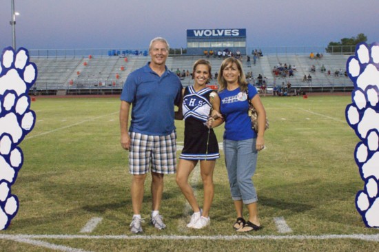 With her parents at Senior Night at Chandler High School.