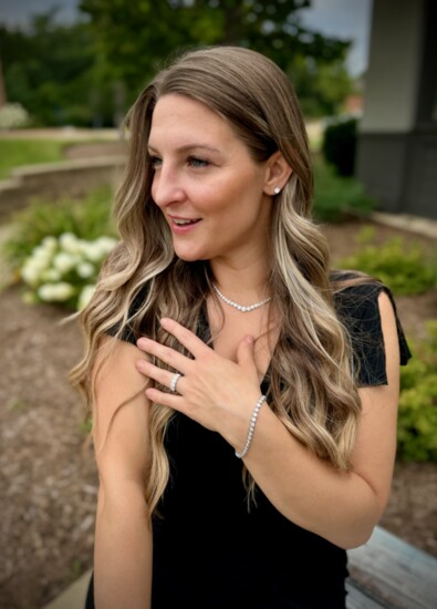 White gold ensemble, including 0.51 carat diamond earrings and 5-stone diamond ring