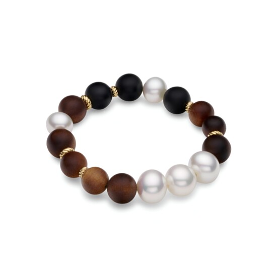 Paspaley Kimberley Golden Dusk Dark Sandalwood, Onyx, and South Sea Pearl Bracelet, $2700. 