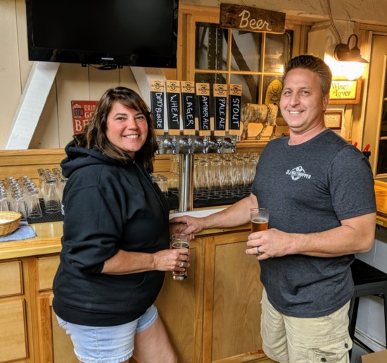 Brewmaster Vance Ferrari and his wife, Kim, showing off the six different beers on tap