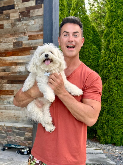 With the neighbor's dog, Dizzi