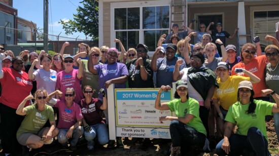 Women Build volunteers take a break for a quick photo on the 2017 Women Build home./Photo by Jennee Galland