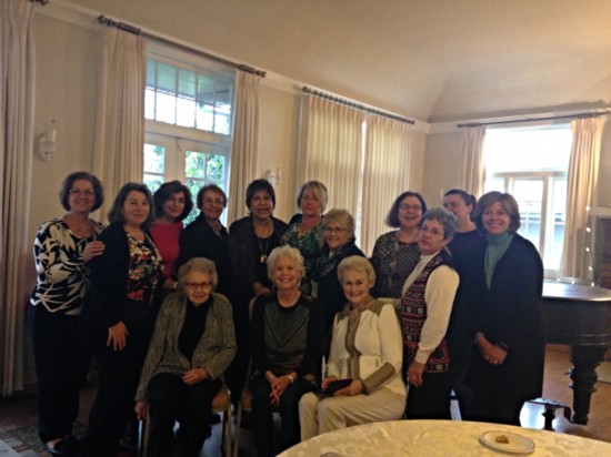 Members gathered together for a group photo after a luncheon.