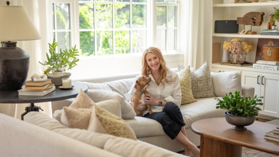 Judith in her home with dog and Bungalow Furniture/decor