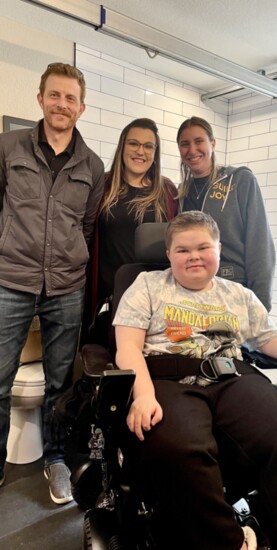 FBC Project team, Jamie Saer, Project manager, Kacie Anderson, Senior Designer, Carly Egyed, Superintendent, with Luke Bowman in his new bathroom.