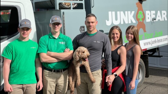 From L-R, Rob Paradis' son Bjorn, his brother Aaron, Rob holding the family dog, Berkley, his wife Kim, and his daughter Katelyn.