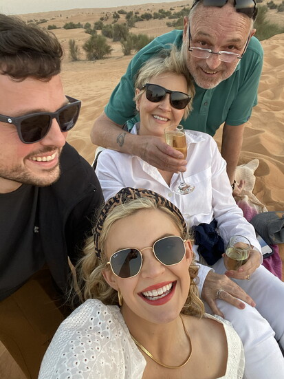 Philip and Regina Price with Derrick and Courtny Rinehart, in the Arabian Desert, during a champagne toast at sunset