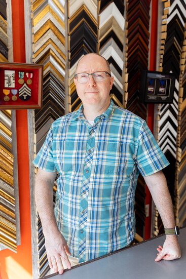 Joel Kurlan inside JW Frame Crafters in Glastonbury.