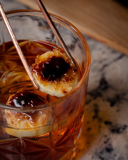 Banana Rum Old Fashioned with Bruleed Bananas
