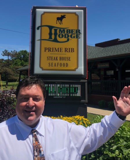 New owner Lynn Zarcone beams with pride as he poses in front of the restaurant on Pearl Road in Medina.