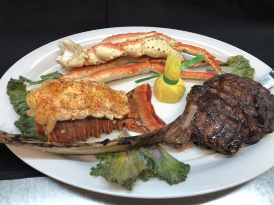 Tomahawk, lobster and crab legs
