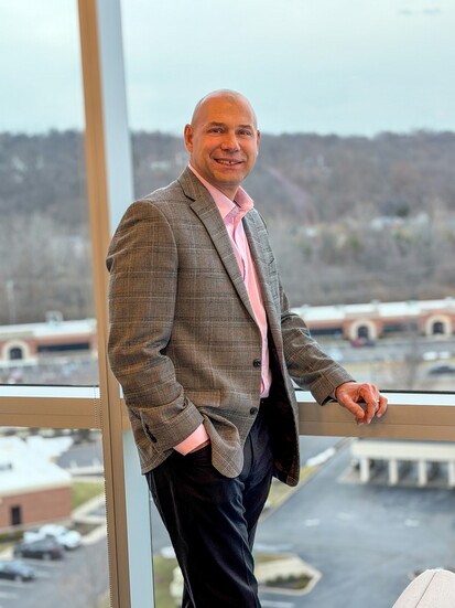 Kemba Credit Union President + CEO Dan Sutton surveys the township from the tallest building in West Chester, Kemba's Operations Center.