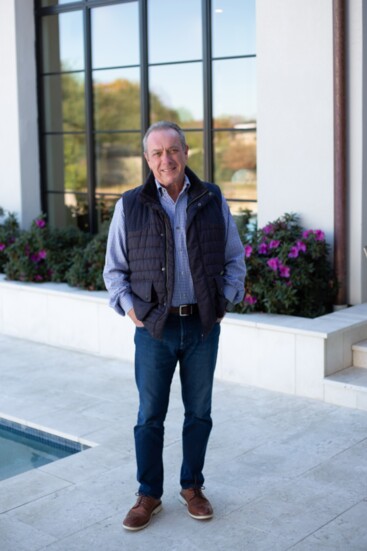 Nick in the serene backyard of one of his custom homes.