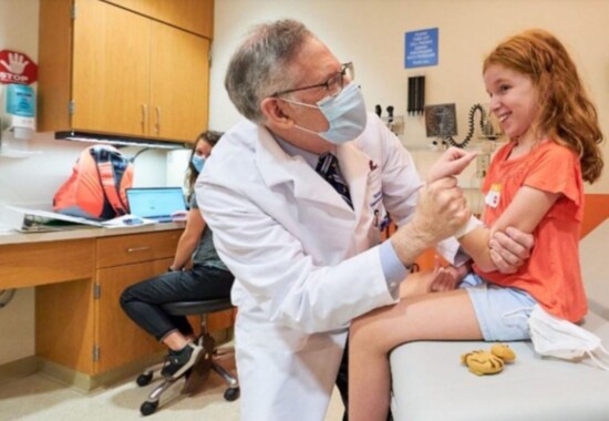 A patient at St. Jude with her fabulous Doctor.