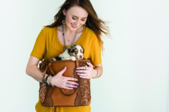 Jenna DeBow layers a cool watch with mixed-metal bracelets and cradles a furry surprise in this great Brighton bag 