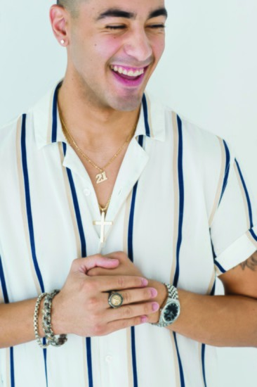 Austin Whiting rocks a custom-made necklace and layered bracelets, not to mention those diamond studs.