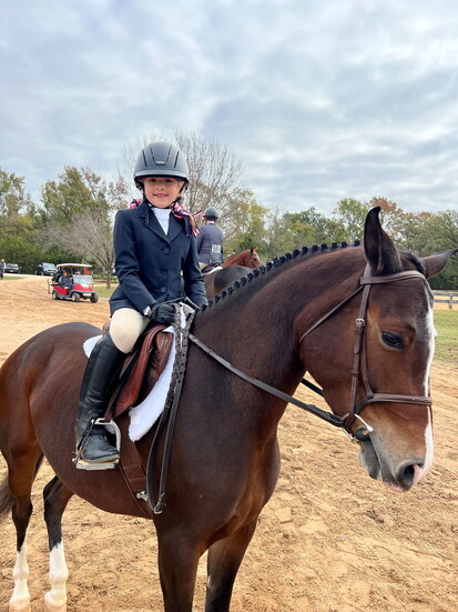 Tie's daughter Gemmah riding her horse Gypsy.