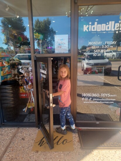 Liam Davies walks through the little door at the newest iteration of Kidoodles in Carriage Plaza in Norman. (Photo by Lindsey Davies)