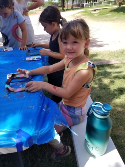 Despite the heat, the shady trees made painting horseshoes outside a bit more bearable.