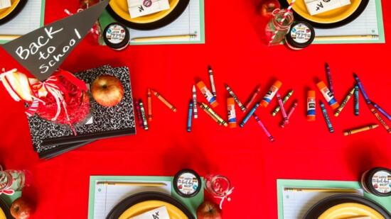 Each place setting included a personalized No. 2 pencil , mini cake in a jar and favor bag