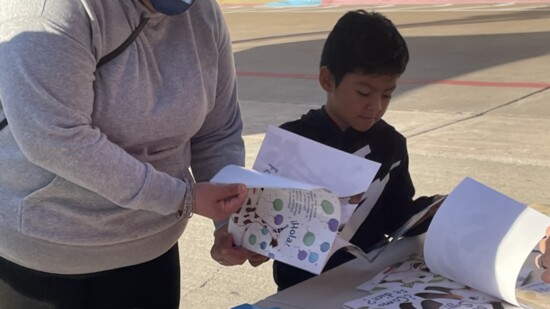 A local Kids Matter event distributing books