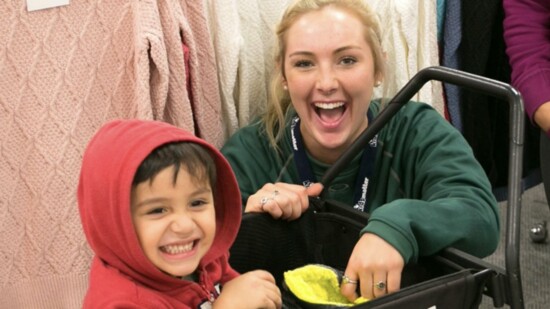 Volunteers have a blast helping kids shop and maximize their $100.
