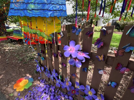 Neighbors contributed old soda cans to create the garden flowers and butterflies at The Kindness Rocks Project (Va.). Credit: The Kindness Rocks Project (Va.)