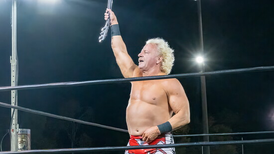 Wrestling Superstar Jeff Jarrett holds his signature guitar during a match at the 2025 Hendersonville Pig Fest.
