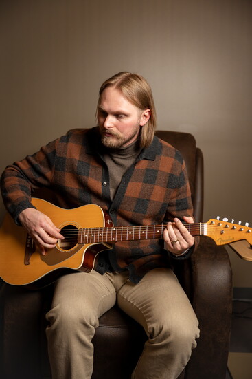 Cam Gibson in the music room, one of the many thoughtfully designed spaces at the center