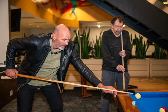 Kirk playing pool with Harry Neuman