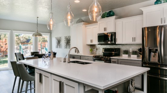 Tip 1 Open shelving at the end of an island or a counter is a great and functional way to store and display kitchen knick-knacks and cookbooks.