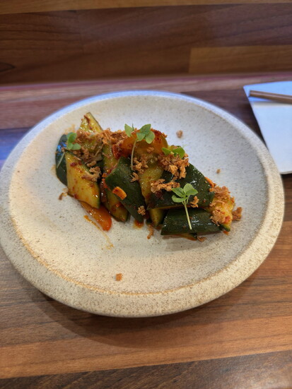 The Sunomono Salad: pickled cucumber, tomato, crispy garlic and shallot.