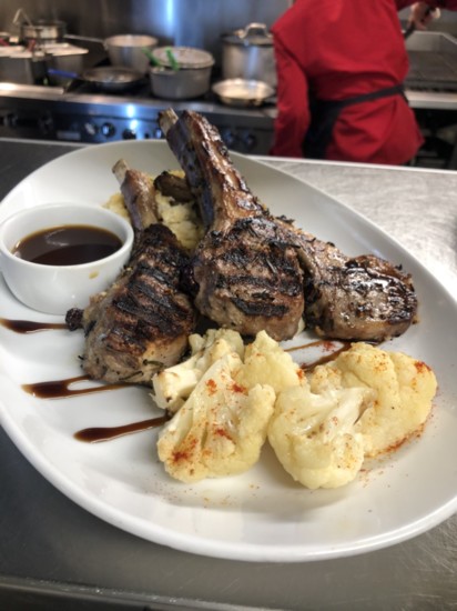 Marinated Colorado Lamb chops with cauliflower and our signature hash brown casserole