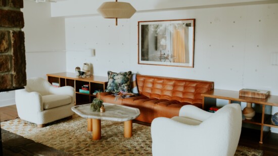 Most of the interior walls are made of concrete. Hayley used textured rugs and various layers to create warmth.