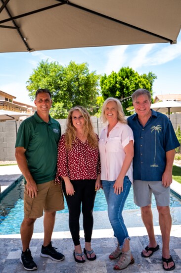 Arizona's Greenest Grass owners Eric and Leslie Noyes (left) with homeowners Deb and Jim Marchant (on the right)