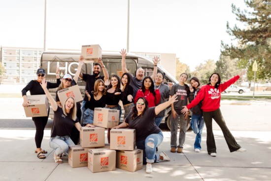 Arvada Lifestyle, Lantern Home Group, and Arvada High School students team up to unload donated meals from Arvada's Thanksgiving Food Drive..