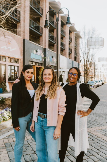Designer, Lauren Billow, Jess, and Danielle strike a pose on Main St. in Trilith.  