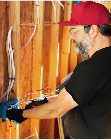 Joshua Asher busily rewiring