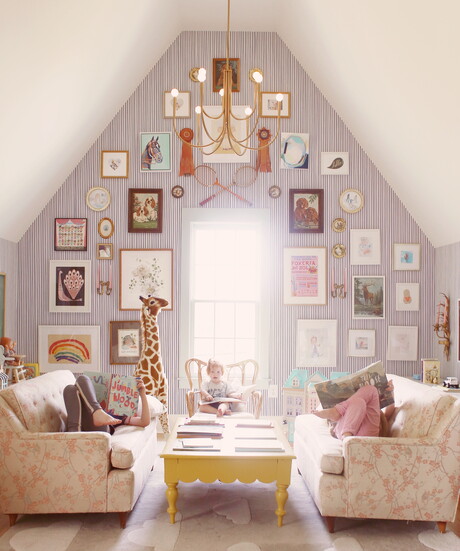Books, bold patterns, and a giraffe—this storybook space invites curiosity and comfort.