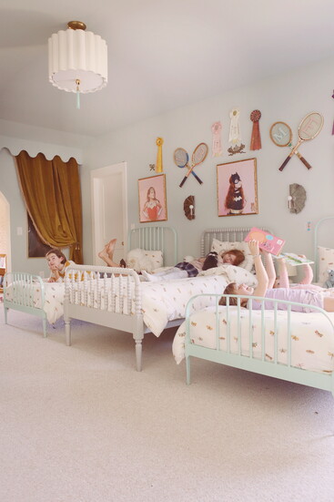 Playful, personal, and full of vintage flair—each detail in this shared bedroom tells a story all its own.