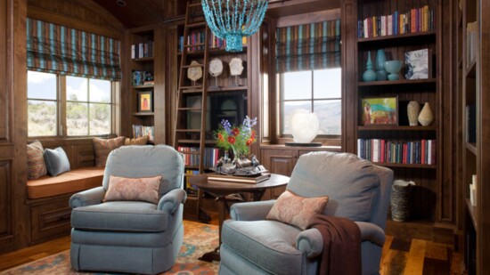 This home's cozy library has plenty of places to sit and read . The home was designed by Connie LeFevre. Photo by Kimberly Gavin Photography 